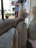 Sidewalk Shopping with Brown Bags