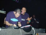 Purple-shirted deejays making music