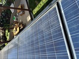 Residential Solar Panel Installation Above Backyard Deck
