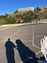 Empty Parking Lot with Shadows and Bike Racks