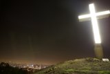 Illuminated Cross Atop the Hill