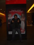 Thumbs up for an Advertisement in Front of the TV