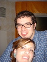 Couple Smiling Together in Cozy Indoor Setting