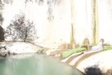 Tranquil Waterfall in Nature's Fortress