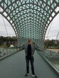 Arms Wide on Bridge of Peace