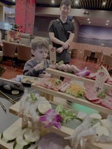 Young Child Enjoying Sushi Restaurant Experience