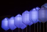 Blue Kites Light Up the Night Sky