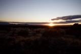 Desert Sunset Over Distant Mountain Ranges