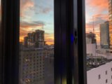Metropolis Sunset from High Rise Window