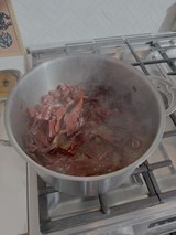 Red Onions Caramelizing in Steel Pan