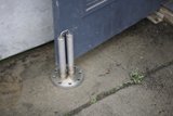 Rusty Handrail on a Corroded Door