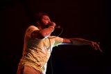 Coachella Performer Takes the Stage with Microphone in Hand