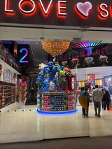Colorful Candy Store Display with Blue Balloon Sculpture