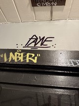 Urban Street Art and Graffiti Tags on Building Wall