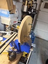 Wooden Wheel Secured in Blue Workshop Vise