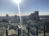 Bright Sun over the City Skyline