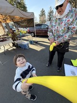 Joyful Moment with Giant Inflatable Banana at Market