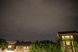 Nighttime view of a striking building under cloudy skies