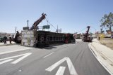 Overturned Truck Lifted by Construction Crane on Street