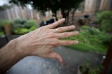 Hand with Wedding Ring in Garden Setting