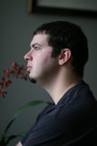 A Man Lost in Thought Among Blooms