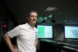 Man in front of a Magnificent Screen