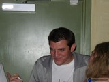 Smiling Man with Baby Indoors