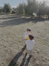 Children Playing Together in Rural Field