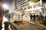 Nighttime Crowd on the Metropolis Sidewalk