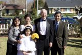 Family Portrait in Front of their Home
