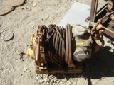 Rusty Hand Pump Abandoned on the Ground