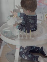 Toddler Playing in High Chair Activity Center