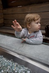 Toddler's Focused Moment at Water Table Play