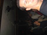 Man Commands Attention from Crowd at Nightclub