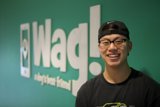 Ning Zetao Smiling in Front of WAG Logo
