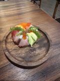 Savor the Flavors of Fresh Sushi on a Wooden Plate