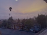 Suburban Twilight Through Foggy Hills