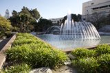 A Serene Fountain in a Lush Park