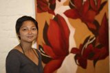 Woman Admiring Floral Painting