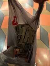 Plastic Shopping Bag with Toy Cars on Colorful Floor