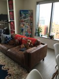 Brown Leather Couch in Chic Living Room