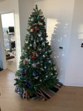 Festive Christmas Tree in a Wood Floored Room