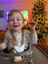 Joyful Toddler's Christmas Dinner Celebration at Home