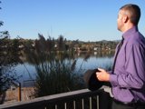 The Purple Shirted Gentleman by the Water