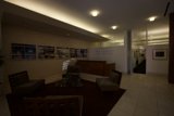 A Cozy Lobby with Wooden Flooring and Art Deco Furniture