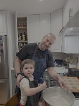 Father and Son Cooking Together in Kitchen