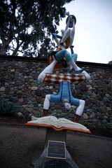 Whimsical Acrobatic Book Sculpture at Dusk