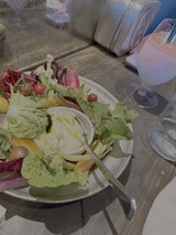 Fresh Garden Salad with Wine on Table