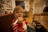 Toddler Eating at Home in Red Striped Pajamas