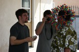 Friends Photograph Man Wearing Colorful Straw Toy Hat